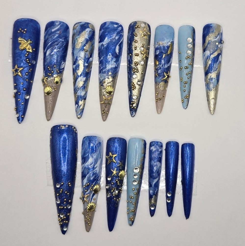 Long stiletto blue beach nails